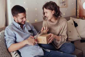 young-cheerful-couple-love-with-gift-christmas_78203-2545.jpg